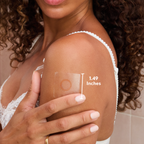Woman applying a adhesive patch on her arm with measurement label