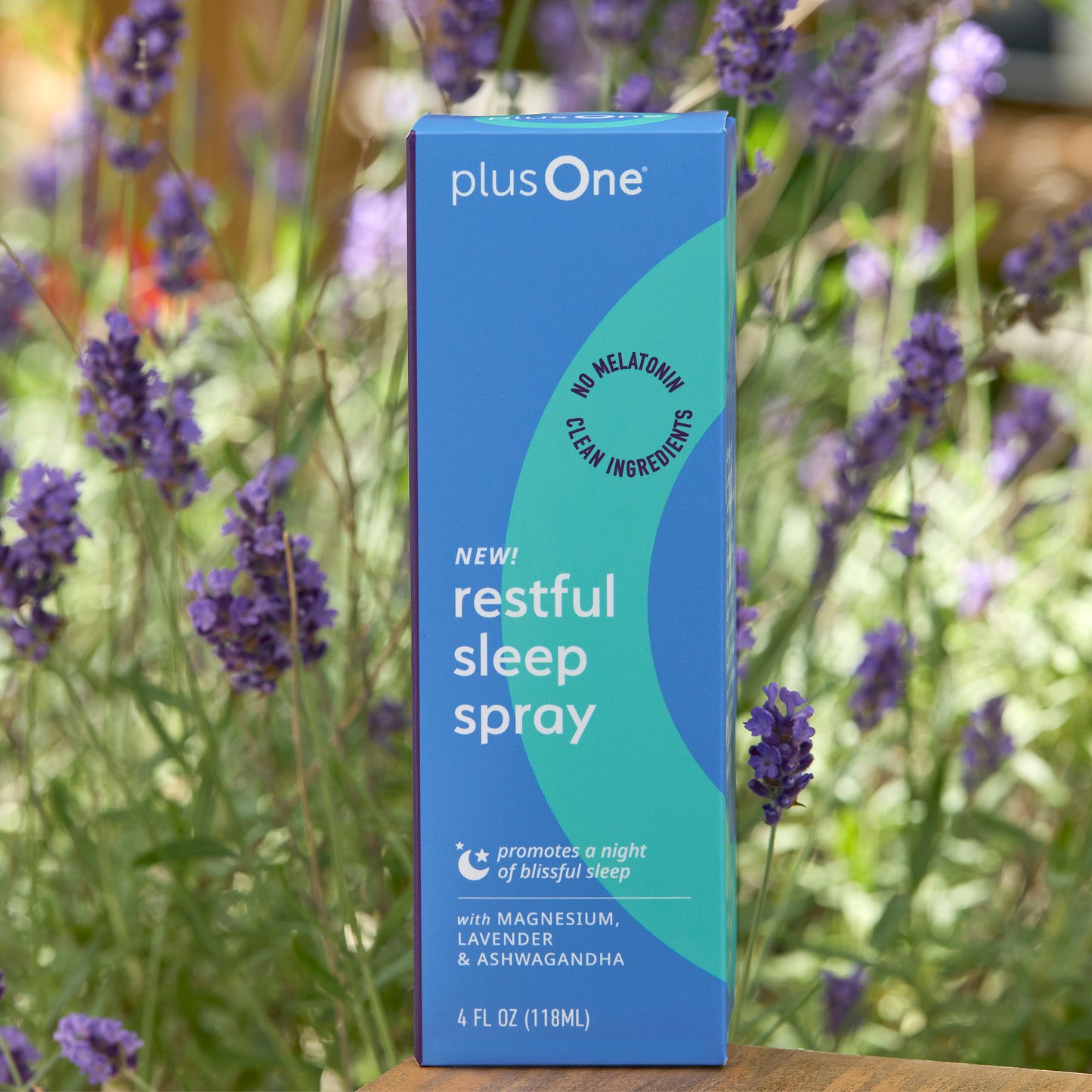 plusOne restful sleep spray box with lavender flowers in the background