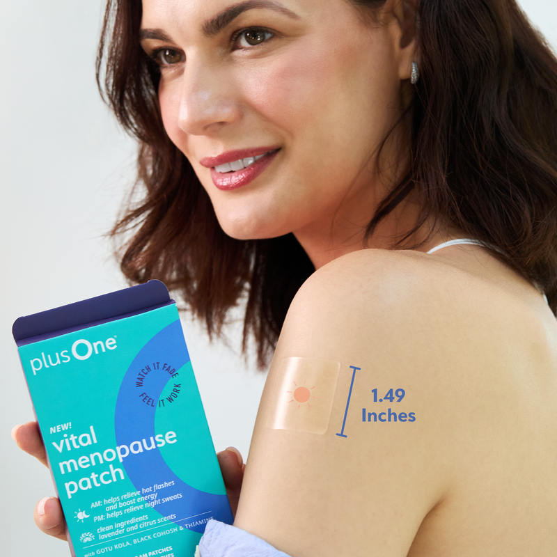 Woman with a vital menopause patch on her arm and holding the plusOne product packaging.