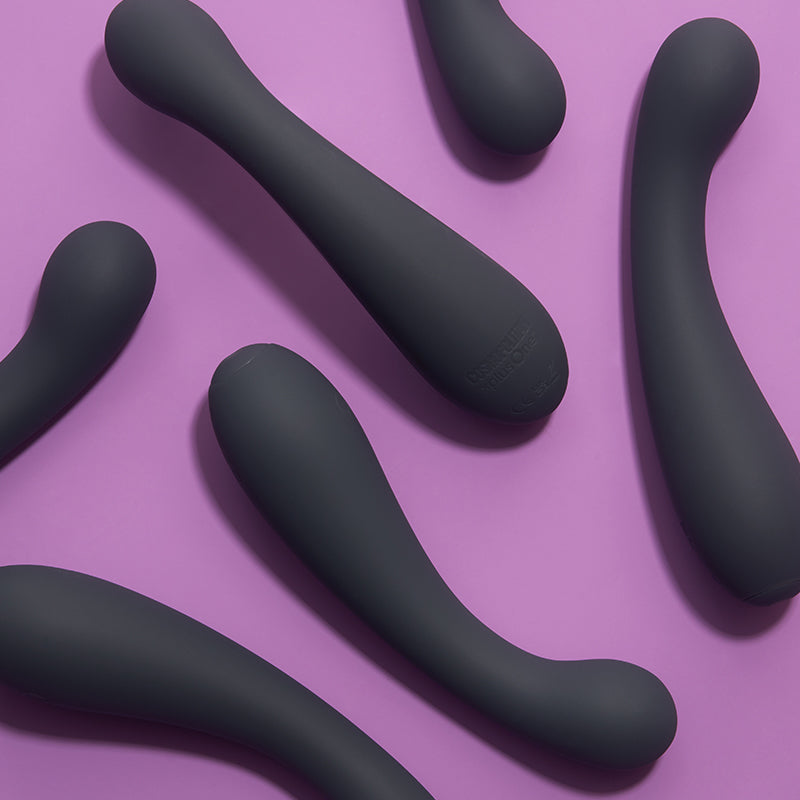 Black curved vibrators on a purple background