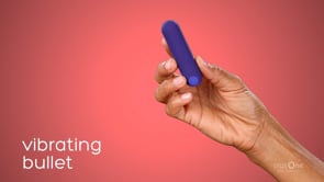 plusone vibrating bullet in a persons hand on a red background